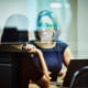 Businesswoman in discussion with client in office conference room